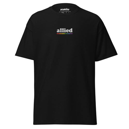 Introducing the "Allied T-Shirt" by Pridelity: a stylish black T-shirt featuring the word "allied" in lowercase letters on the chest. The white letters are creatively outlined with a rainbow gradient. This piece from Pridelity's Pride Collection celebrates unity and inclusivity with flair.