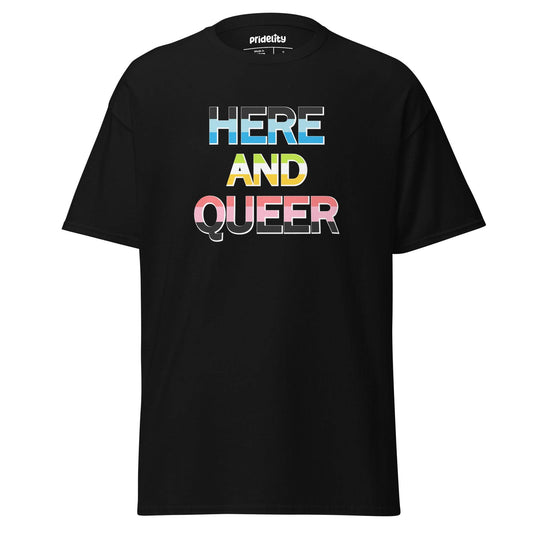 The Pridelity "Here And Queer" T-shirt showcases bold, block letters filled with the vibrant light blue, pink, and white of the transgender pride flag against a classic black background. Make a statement with this eye-catching item from our pride collection.