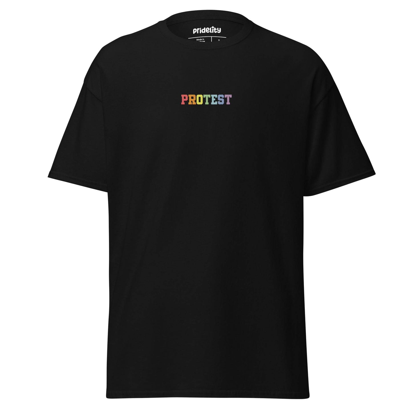 The Protest T-Shirt by Pridelity is a bold black garment featuring the word "PROTEST" displayed prominently in vibrant rainbow-colored letters on the chest, set against a plain white background.