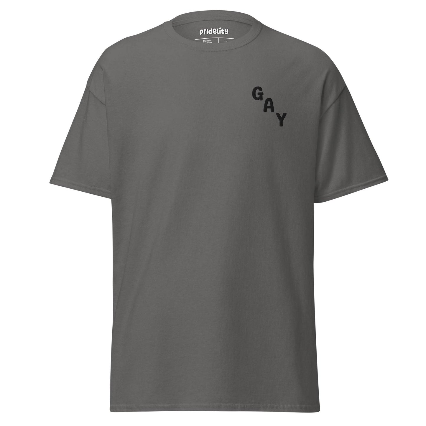 A charcoal T-shirt from Pridelity's pride collection prominently displays "GAY" in bold black letters arranged diagonally on the upper left side.