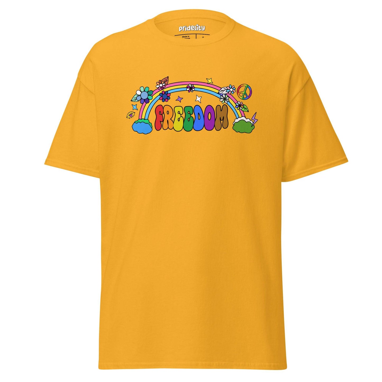 The Freedom T-Shirt by Pridelity features a colorful, cartoon-style design with "FREEDOM" in vibrant letters. A rainbow arches above clouds, flowers, and stars on the beige fabric, creating a whimsical and cheerful piece of pride merchandise.