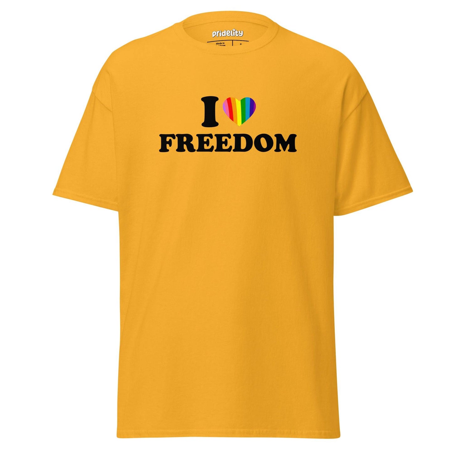 The "I Love Freedom T-Shirt" by Pridelity features a beige design with the bold message "I ❤️ FREEDOM," showcasing a heart symbol vibrantly adorned in rainbow colors, making it an ideal pride shirt.