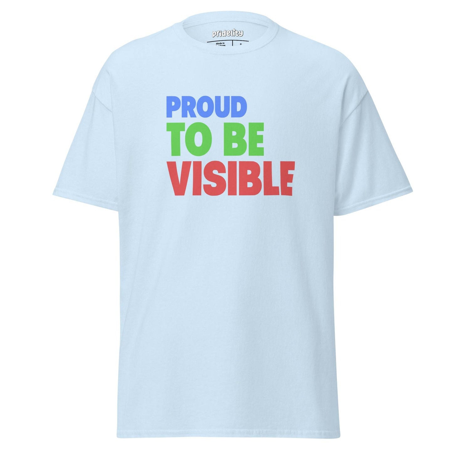 A light blue "Proud To Be Visible" T-shirt by Pridelity, featuring bold and colorful text in blue, green, and red, is showcased against a plain white background.