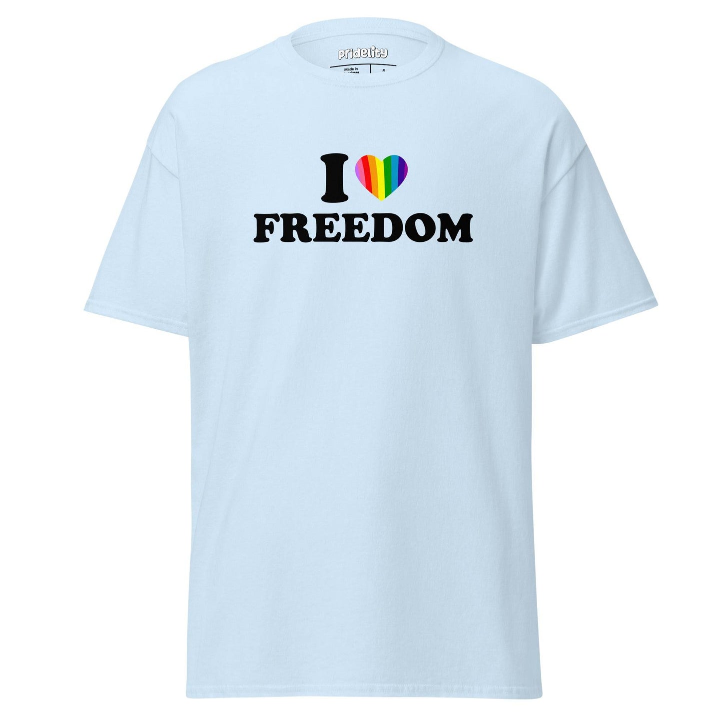 The "I Love Freedom T-Shirt" by Pridelity features a beige design with the bold message "I ❤️ FREEDOM," showcasing a heart symbol vibrantly adorned in rainbow colors, making it an ideal pride shirt.