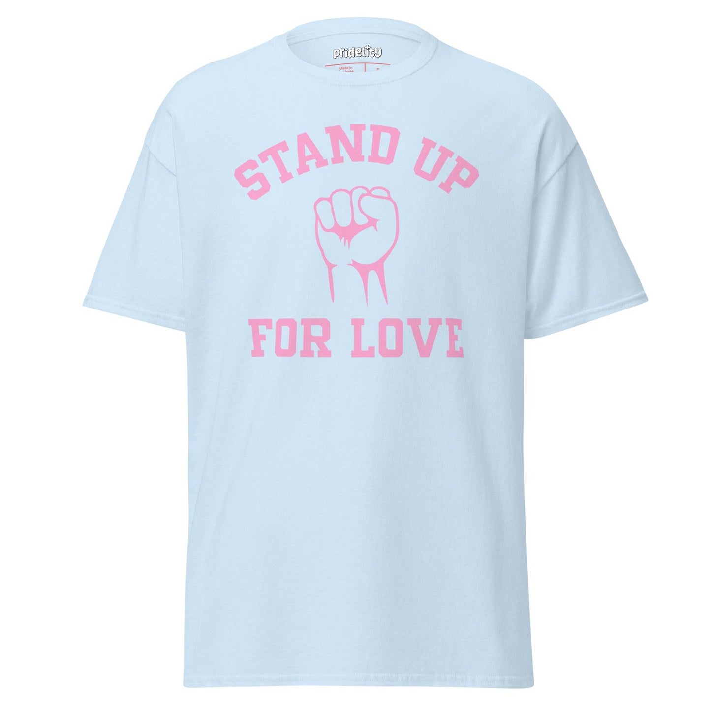 The Pridelity Stand Up For Love T-Shirt, featuring the words "Stand Up For Love" in pink with a bold pink fist graphic at its center, captures the essence of a pride t-shirt in white.