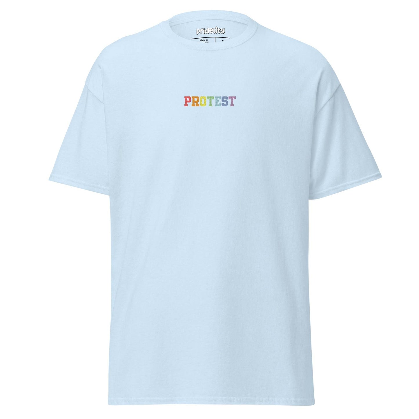 The Protest T-Shirt by Pridelity is a bold black garment featuring the word "PROTEST" displayed prominently in vibrant rainbow-colored letters on the chest, set against a plain white background.