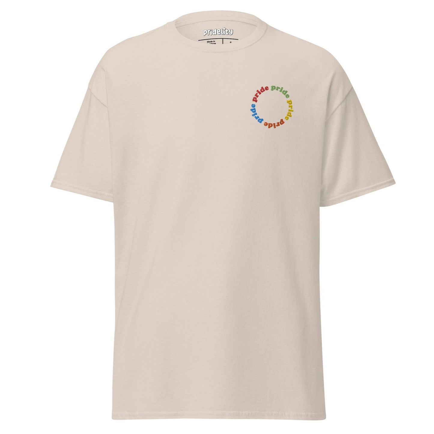 The Pride Circle T-Shirt by Pridelity showcases a beige shirt adorned with a vibrant "pride" text design arranged in a circular pattern on the upper left.