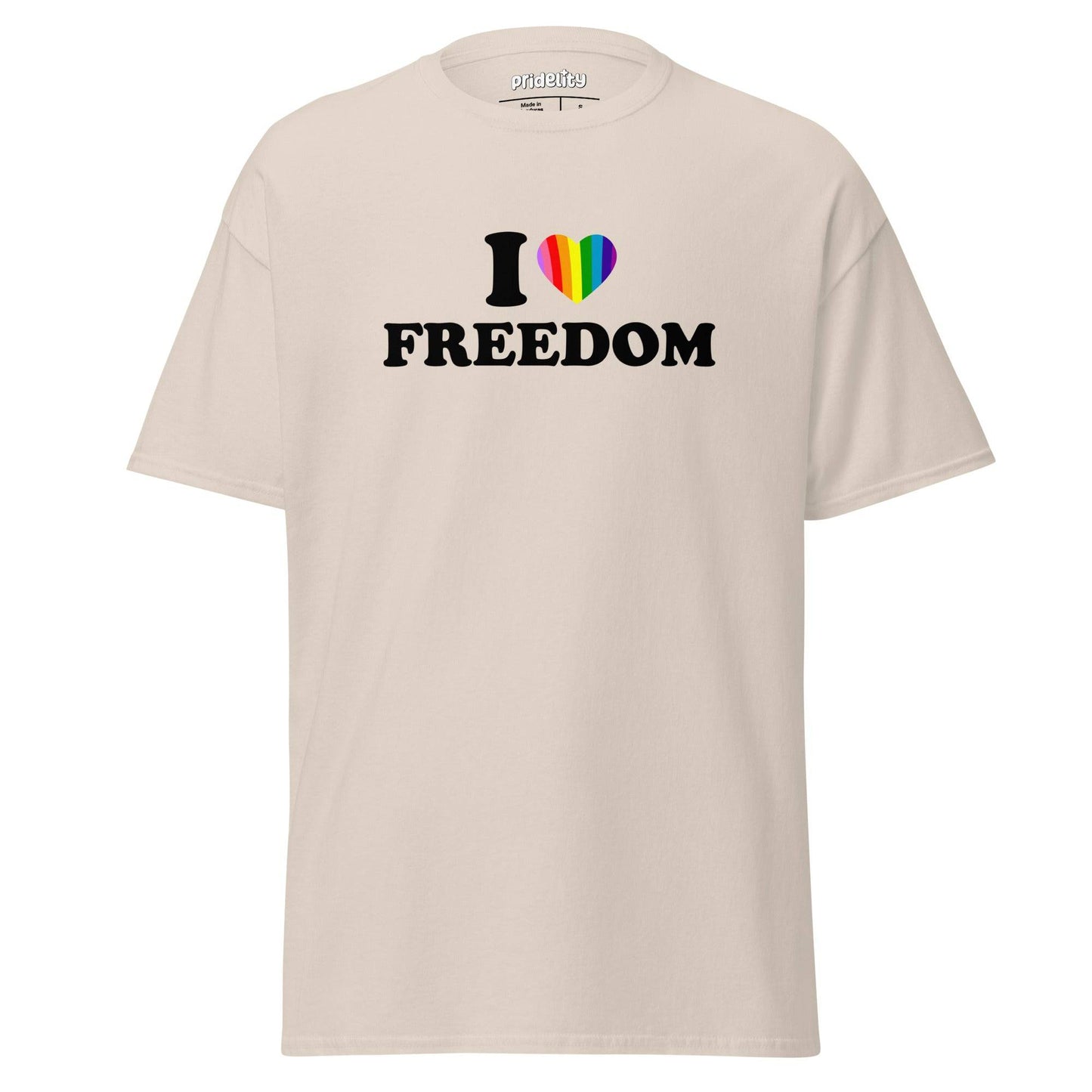 The "I Love Freedom T-Shirt" by Pridelity features a beige design with the bold message "I ❤️ FREEDOM," showcasing a heart symbol vibrantly adorned in rainbow colors, making it an ideal pride shirt.