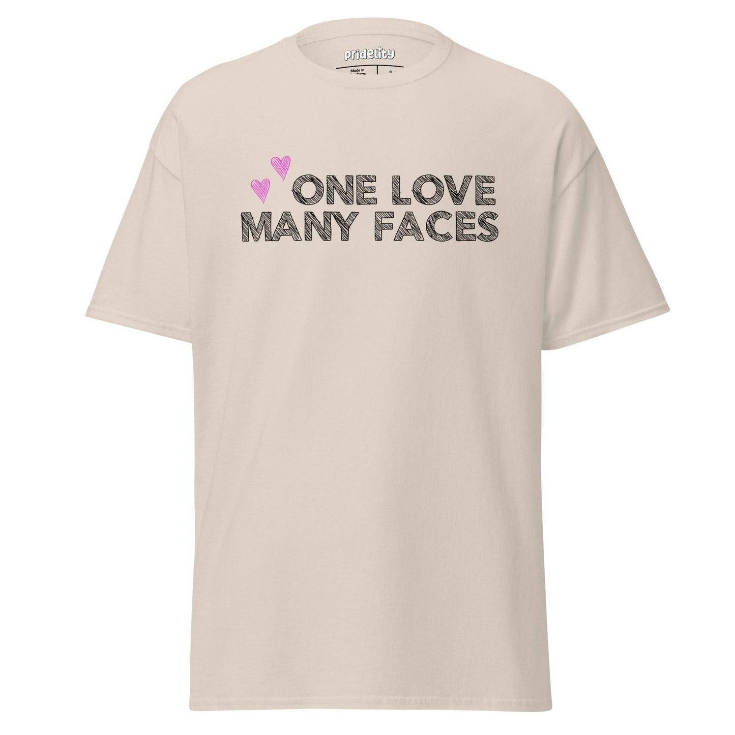 The One Love T-Shirt by Pridelity is a natural-colored pride shirt prominently displaying the message "One Love Many Faces" in bold black letters, complemented by two pink hearts above. It stands out elegantly against a simple white background, celebrating unity and diversity in style.
