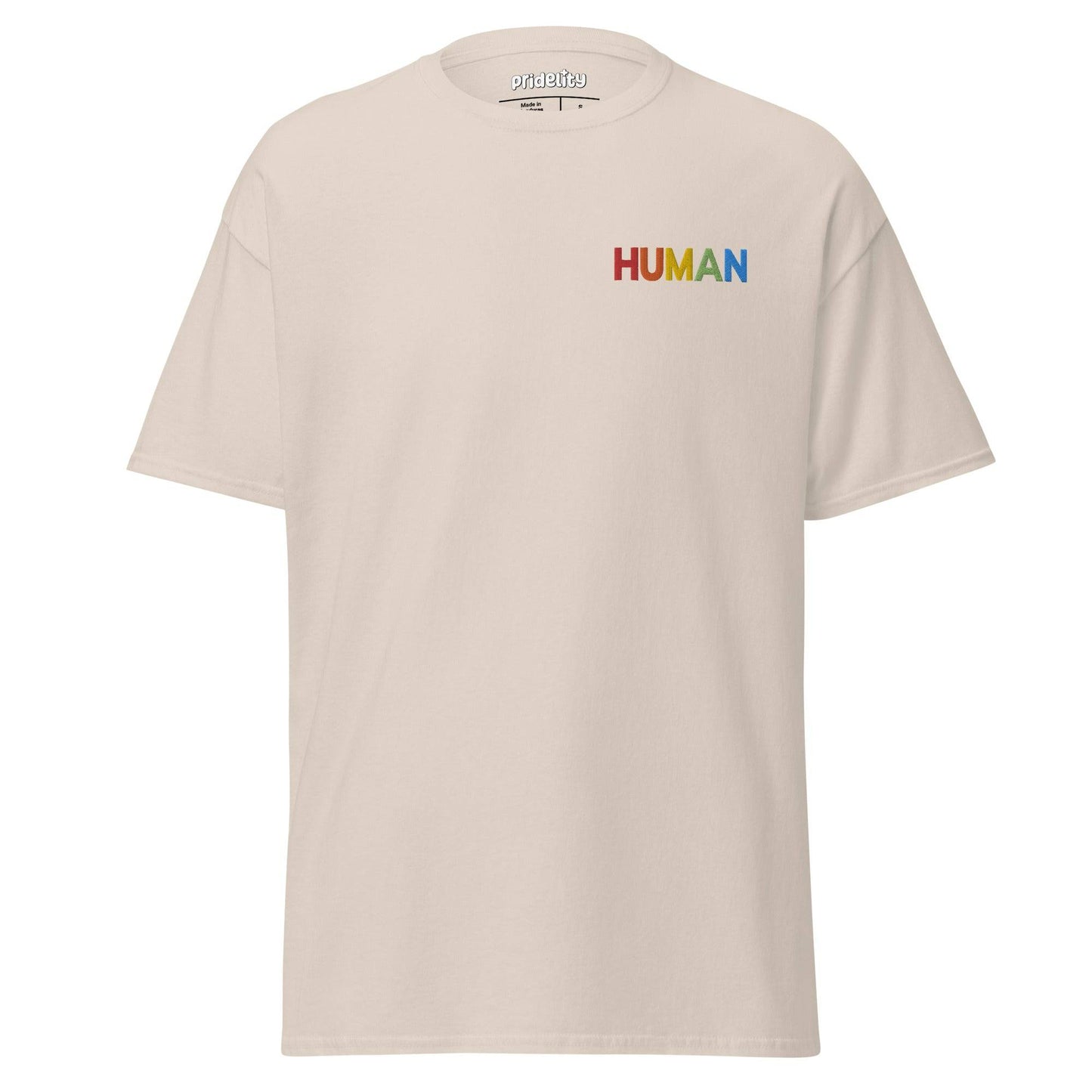 A natural-colored Pridelity Human T-Shirt, adorned with the word "HUMAN" beautifully printed in vibrant rainbow colors on the upper left side.