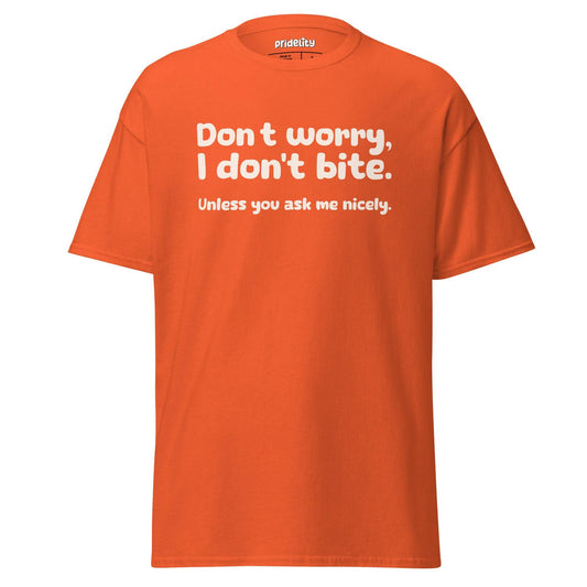 Orange I Don’t Bite T-Shirt by Pridelity featuring playful white text, "Don't worry, I don't bite. Unless you ask me nicely," celebrates individuality and humor in style.