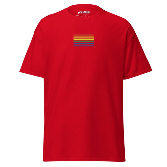 The Rainbow Stripes T-Shirt from Pridelity is black with a small rainbow stripe pattern on the chest, featuring horizontal stripes in red, orange, yellow, green, blue, and purple. The brand name "Pridelity" is printed on the inside label at the neck.