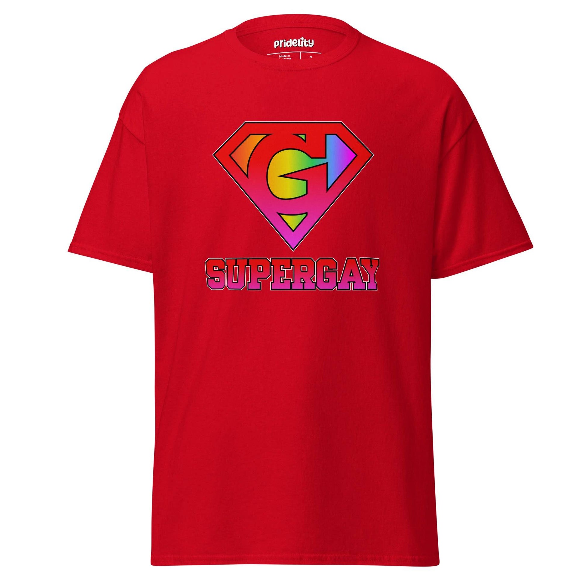 Pridelity's SuperGay T-Shirt in red showcases a rainbow-colored "S" symbol with arrows, reminiscent of the Superman logo, and prominently displays the word "SUPERGAY" underneath in large, bold letters.