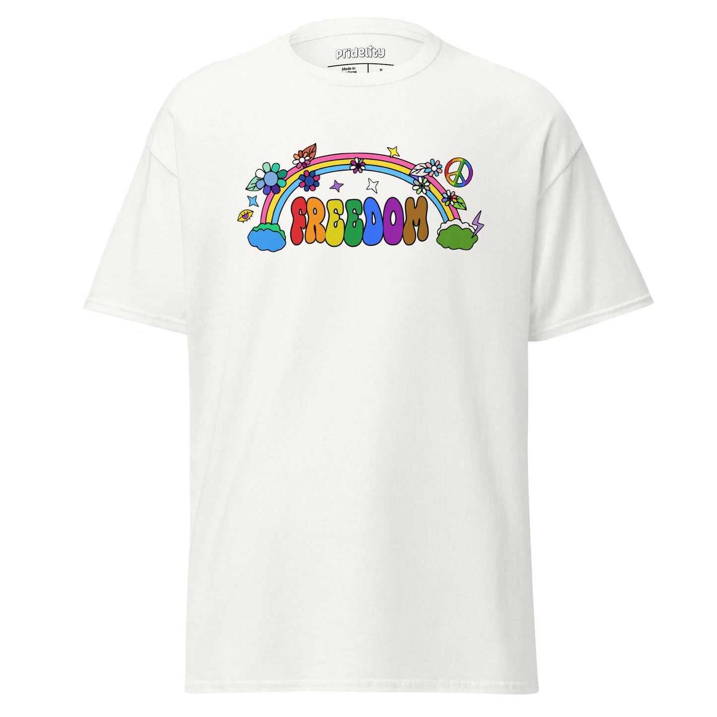 The Freedom T-Shirt by Pridelity features a colorful, cartoon-style design with "FREEDOM" in vibrant letters. A rainbow arches above clouds, flowers, and stars on the beige fabric, creating a whimsical and cheerful piece of pride merchandise.