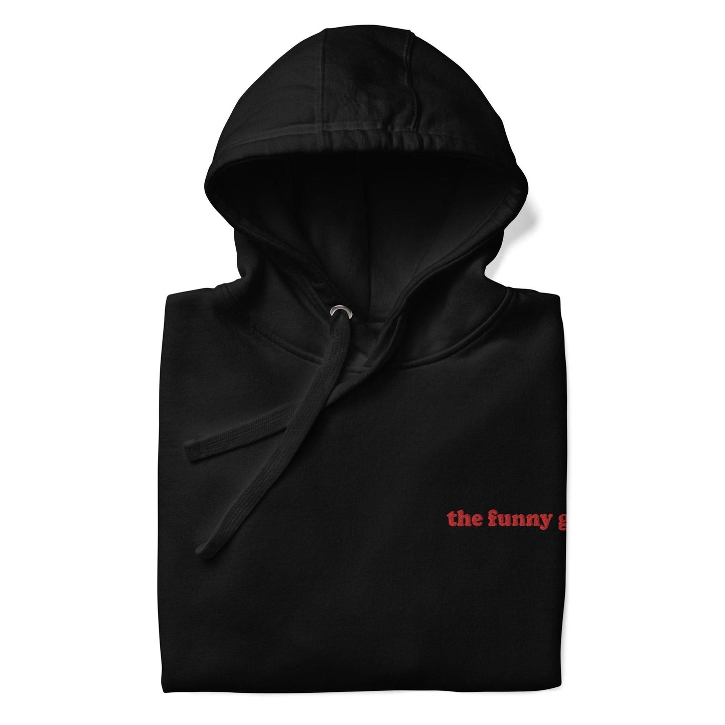 Introducing The Funny Gay Hoodie from Pridelity's pride collection – this black hoodie boasts a convenient front pocket and showcases the phrase "the funny gay" elegantly embroidered in small red letters on the upper left side. Celebrate your style with a nod to LGBTQ+ pride.