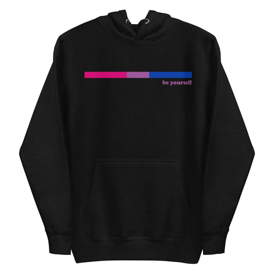 The Bisexual Hoodie by Pridelity features a minimalist design on a black background, showcasing a small horizontal bar in shades of pink, purple, and blue on the chest. Next to the bar, the subtle text "be yourself" elegantly celebrates Pride with style.