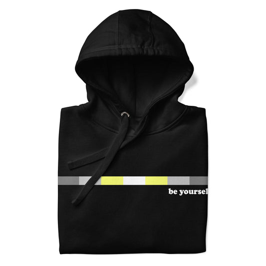 Introducing the Demigender Hoodie by Pridelity: a black pride hoodie showcasing a horizontal progress bar design in gray, yellow, and black shades. The text "be yourself" is prominently displayed beside the bar. The stylish and comfortable hoodie features a front pocket and drawstring hood.