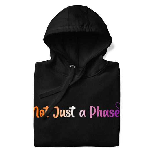 The Pridelity "Not Just A Phase" Hoodie is a black hoodie featuring the text "Not Just a Phase" in multicolored letters, finished with a small heart, celebrating pride shirts with its bold design.