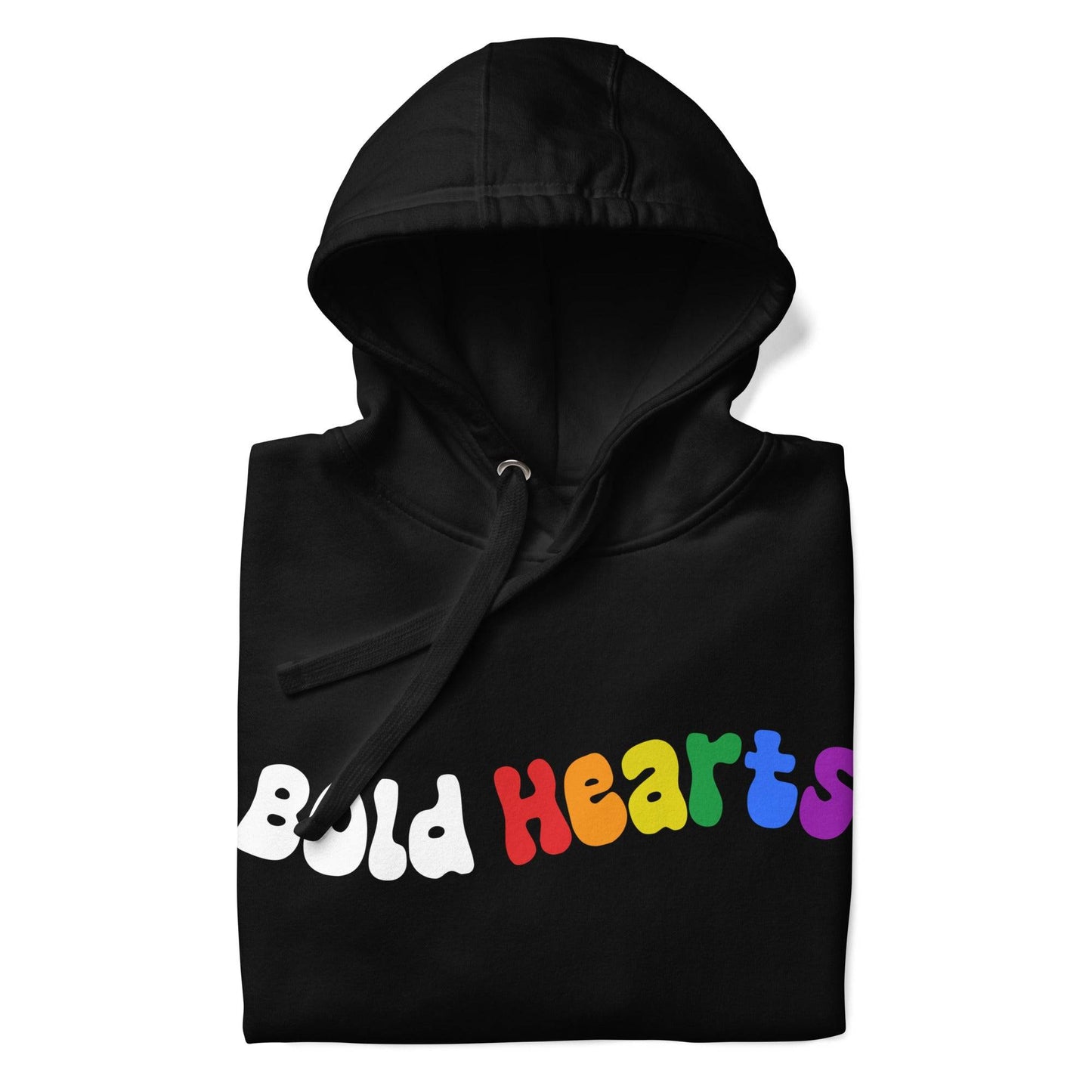 The Bold Hearts Hoodie from Pridelity is a black garment showcasing the words "Bold Hearts" on the front in a playful, wavy font to celebrate Pride. "Bold" stands out in white, while "Hearts" captivates with a vibrant rainbow gradient. This stylish piece of Pride merchandise includes a front pocket and drawstring hood for extra comfort.