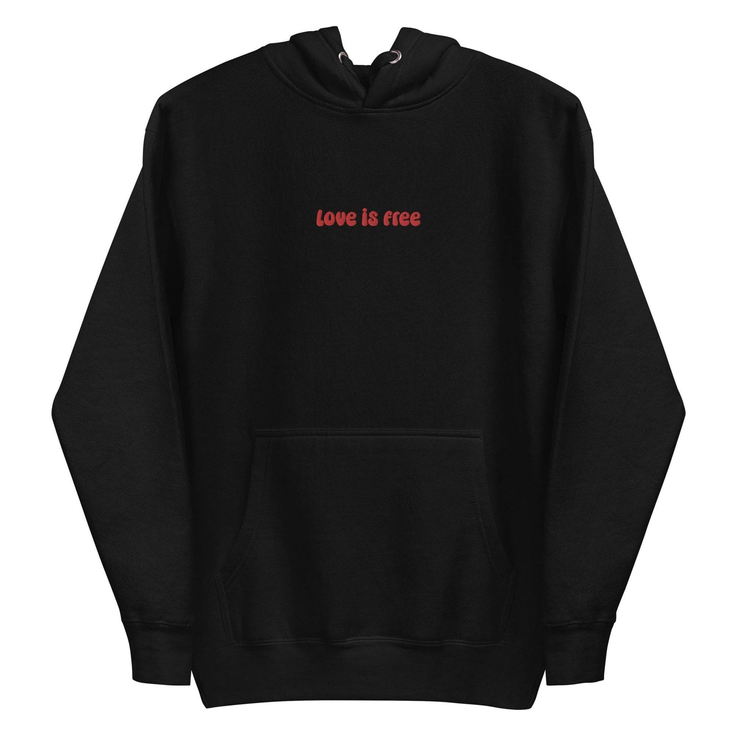 The Love Is Free Hoodie by Pridelity captures the essence of pride shirts with its folded design, featuring a hood and drawstrings, and proudly showcases the message "love is free" in red on its white front.