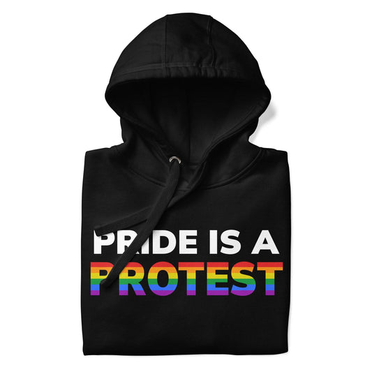 The Pride is a Protest Hoodie by Pridelity features an eye-catching design with the bold statement "PRIDE IS A PROTEST" in white and rainbow-colored letters on the front, set against a black background.
