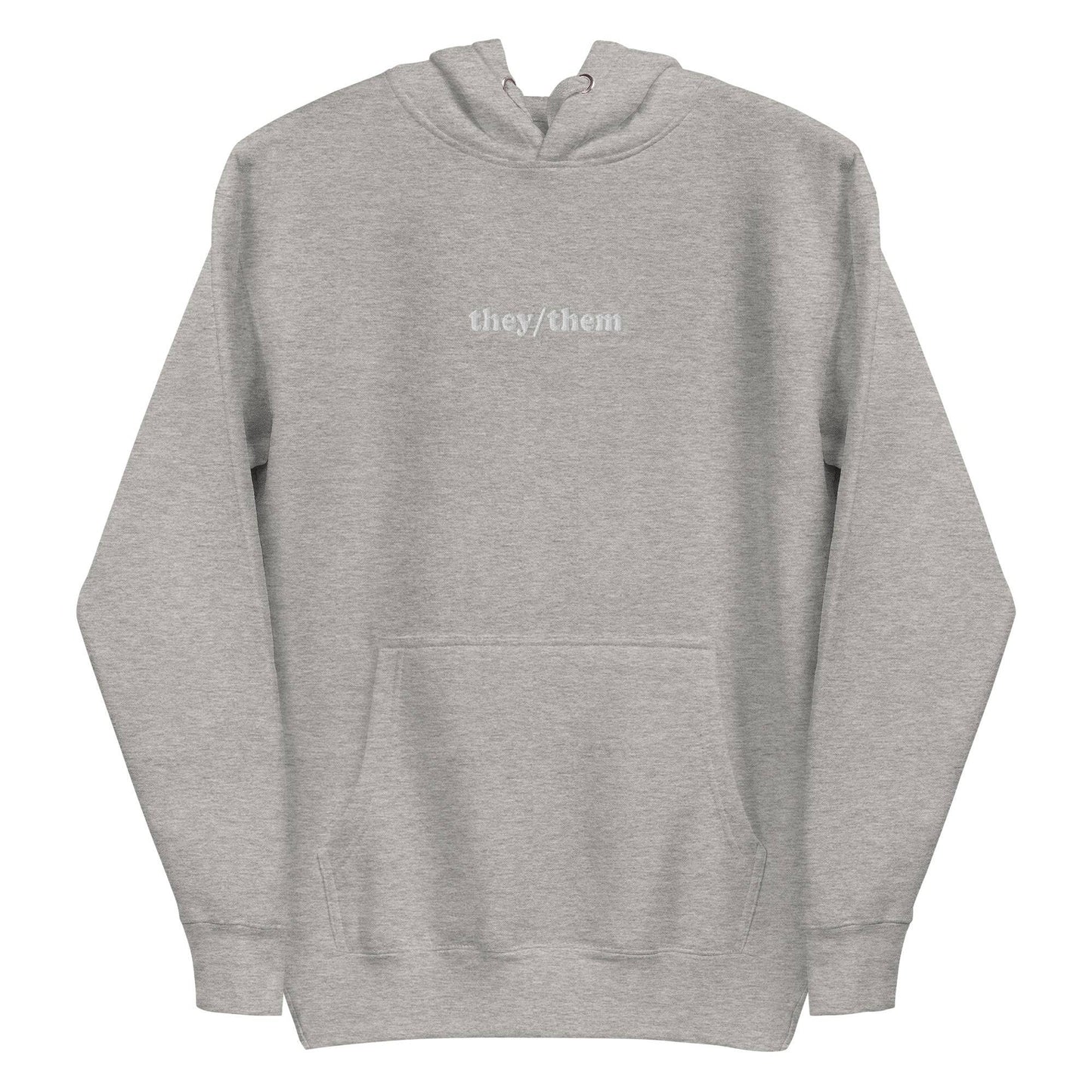 Introducing the They/Them Hoodie from Pridelity's pride collection. This LGBTQ+ friendly piece comes in a folded dusty rose color and features "they/them" text in white on the front. Complete with a drawstring, it offers a soft, casual appearance.