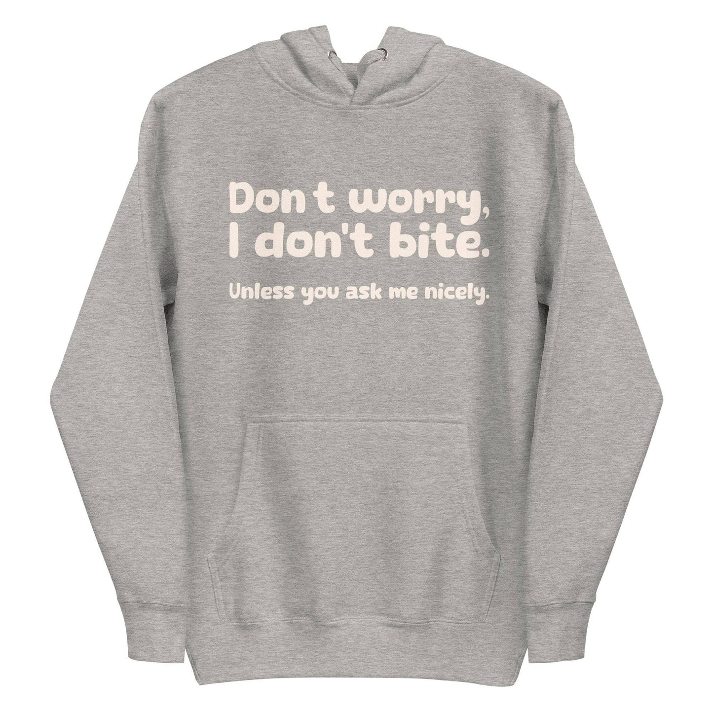 Introducing the Pridelity "I Don't Bite" Hoodie in pink, featuring bold white text on the front that reads, "Don't worry, I don't bite. Unless you ask me nicely." Perfect for those who embrace humor and identity with style.