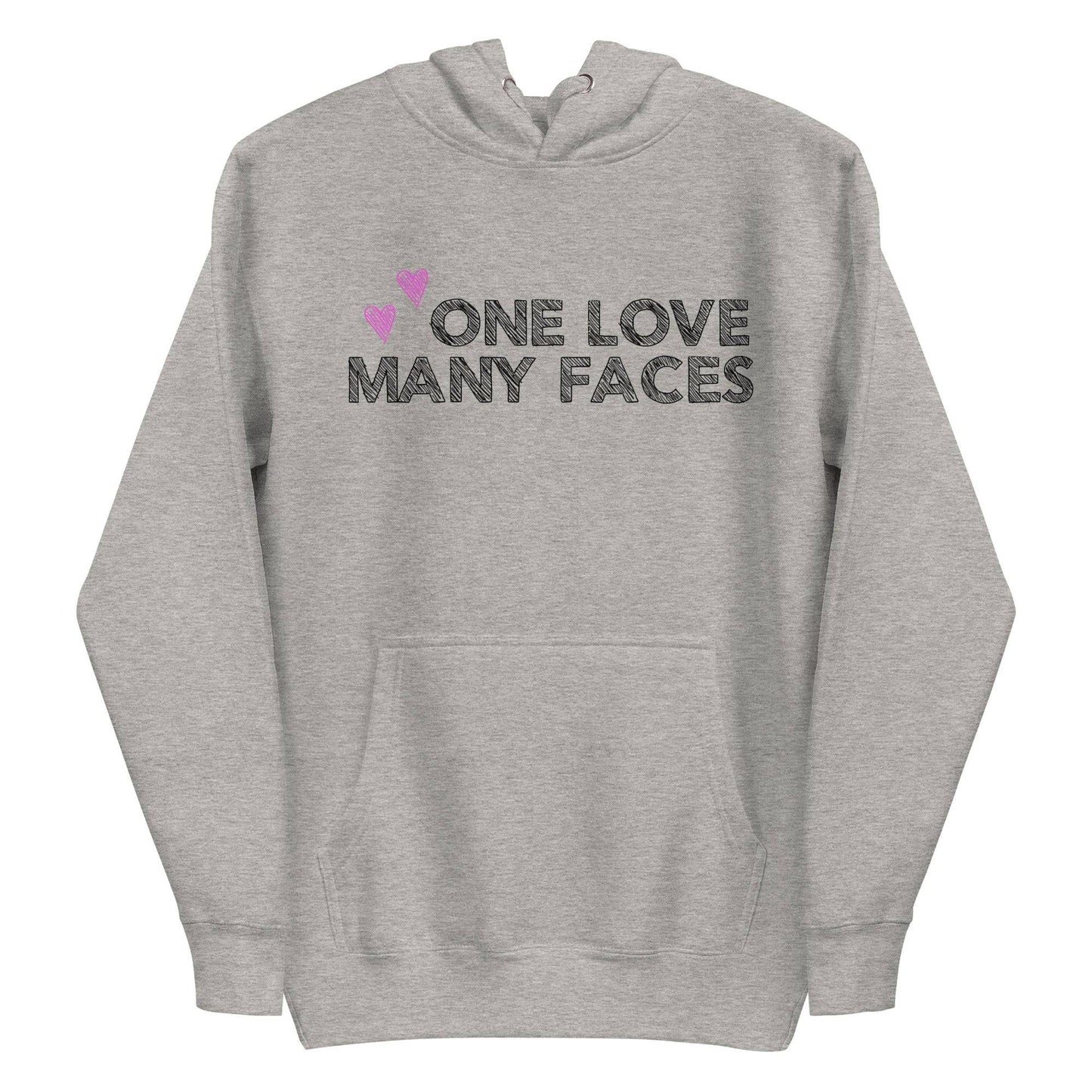 The One Love Hoodie by Pridelity is a folded pink sweatshirt, similar to pride shirts, featuring the bold black phrase "ONE LOVE MANY FACES" on the front. Two small pink hearts are positioned above the text on the left side, enhancing its charm.
