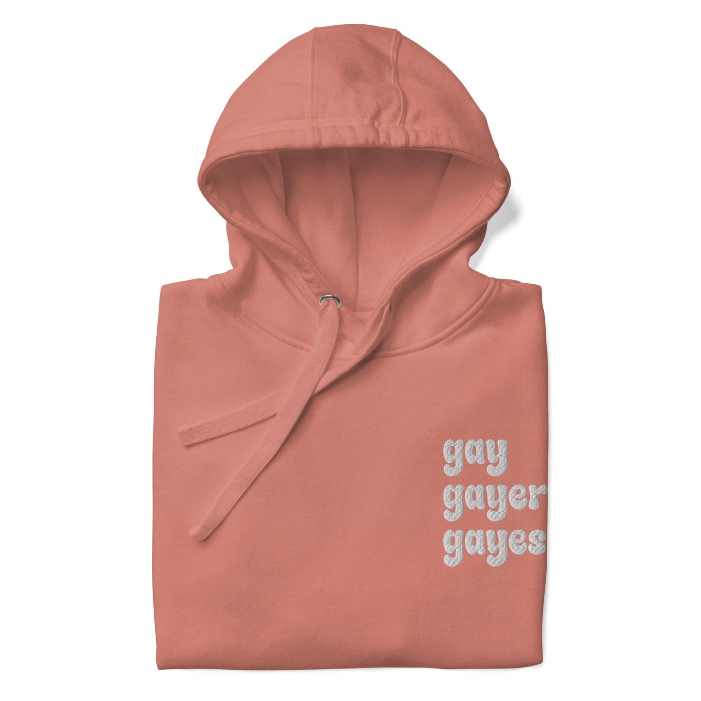 A Dusty Rose-colored hoodie from Pridelity's collection, named "Gay Gayer Gayest Hoodie," features a front pocket and the text "gay gayer gayest" printed in white on the upper left side.