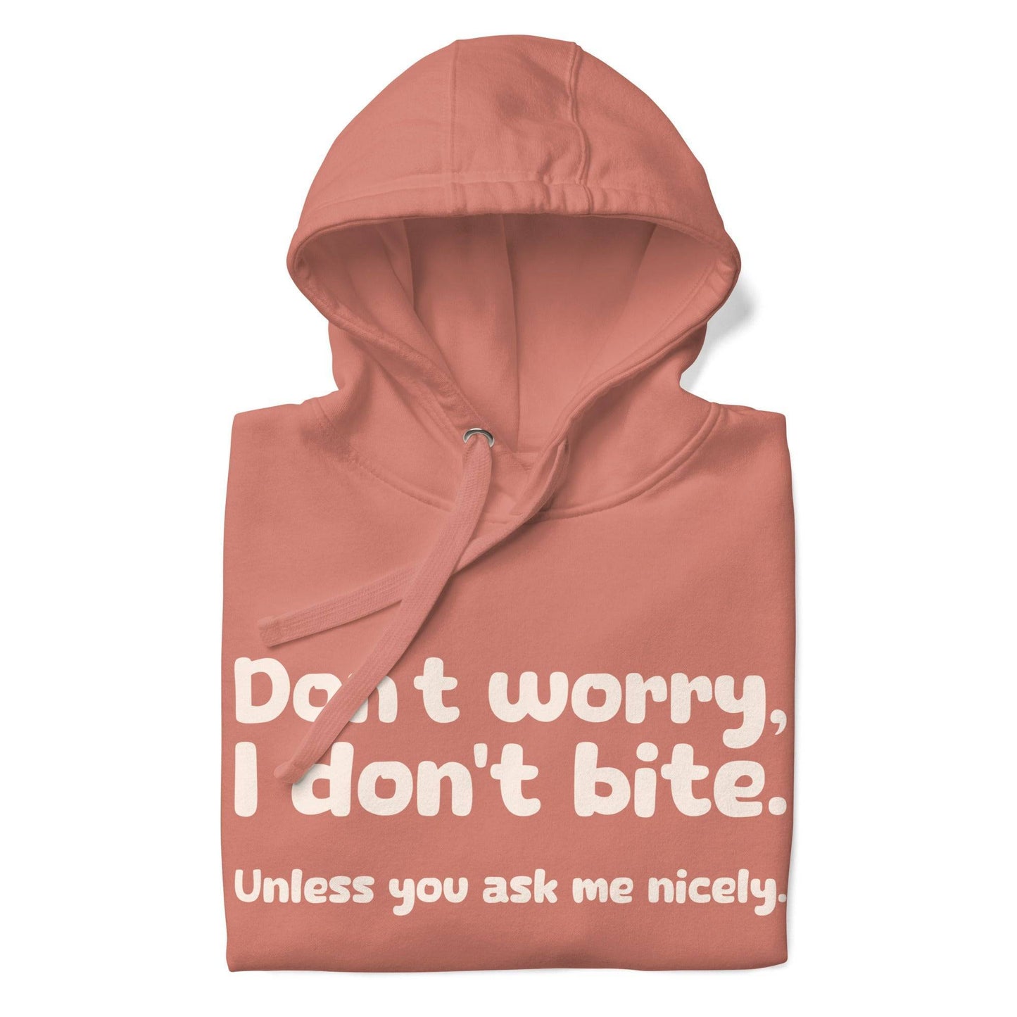 Introducing the Pridelity "I Don't Bite" Hoodie in pink, featuring bold white text on the front that reads, "Don't worry, I don't bite. Unless you ask me nicely." Perfect for those who embrace humor and identity with style.