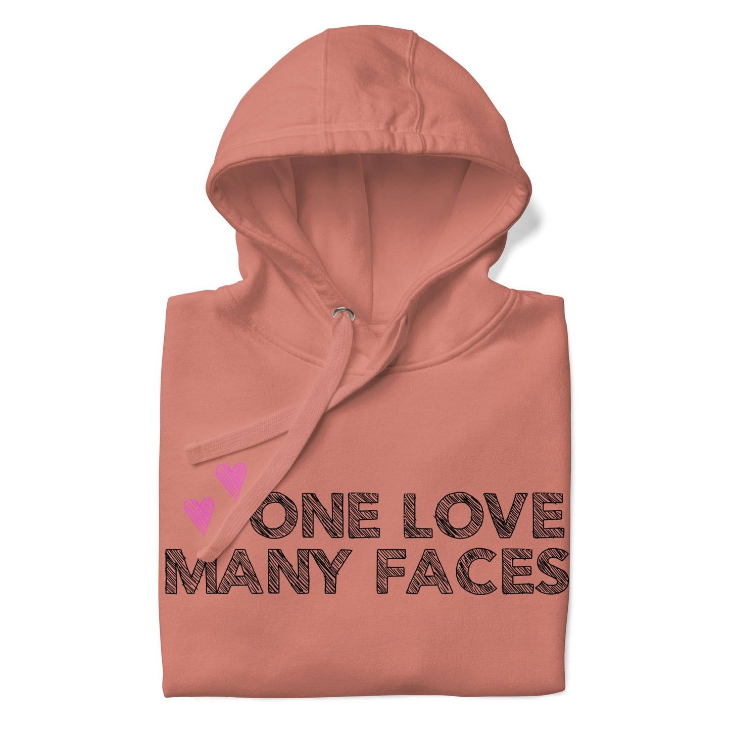 The One Love Hoodie by Pridelity is a folded pink sweatshirt, similar to pride shirts, featuring the bold black phrase "ONE LOVE MANY FACES" on the front. Two small pink hearts are positioned above the text on the left side, enhancing its charm.