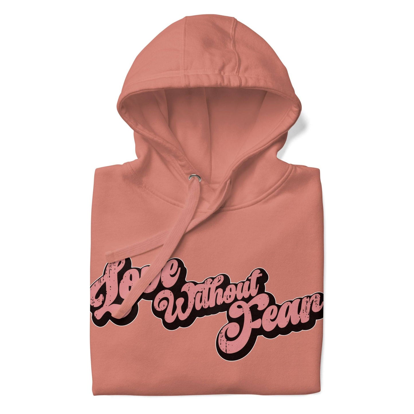 The Love Without Fear Hoodie by Pridelity comes in a dusty rose hue, featuring the phrase "Love Without Fear" across the front in a stylized, bold script reminiscent of classic pride shirts. The vintage text has contrasting black outlines and is centered on the chest. This hoodie also includes a front pocket and drawstrings.
