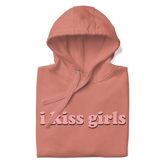 The "I Kiss Girls" Hoodie by Pridelity is a pride celebration in dusty rose, featuring bold, light pink lettering on the front, along with a convenient front pocket and drawstring hood.