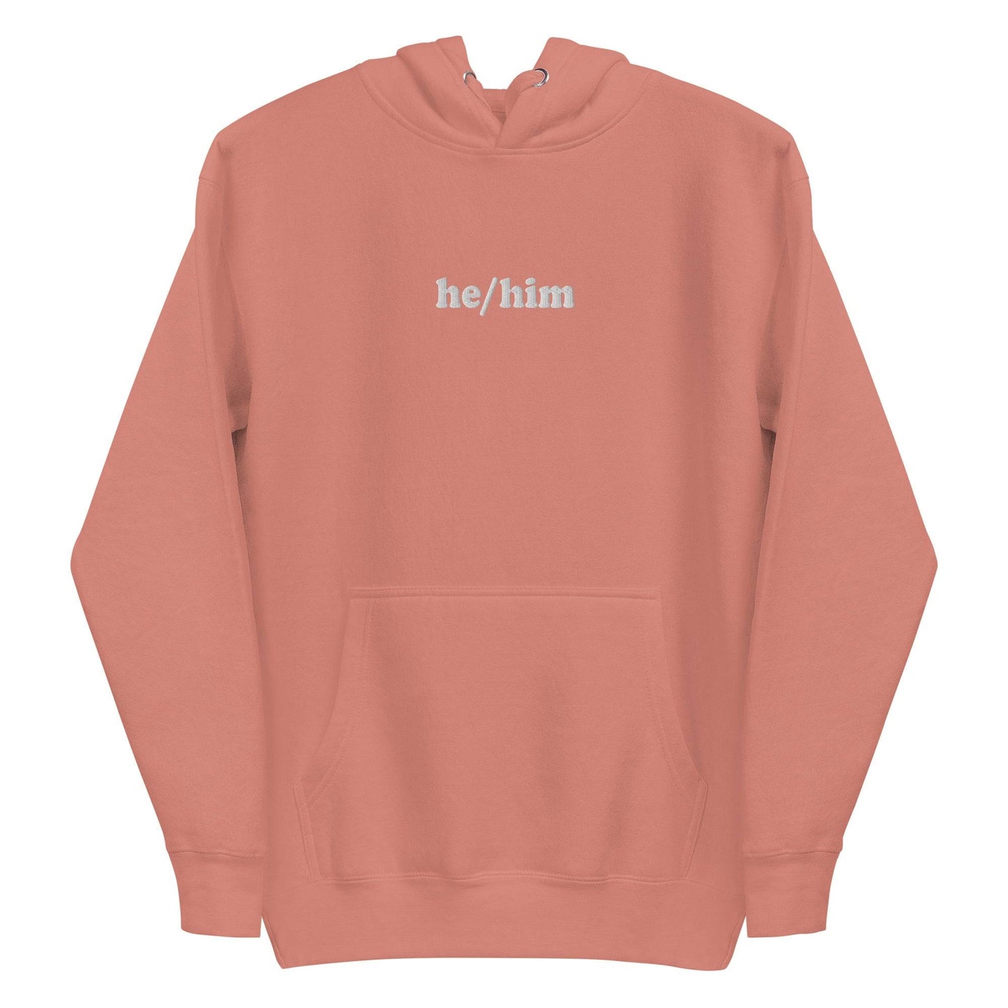 A neatly folded Pridelity He/Him Hoodie in black, featuring the text "he/him" embroidered in white on the front. The hood is showcased with its drawstrings arranged against a plain white background.
