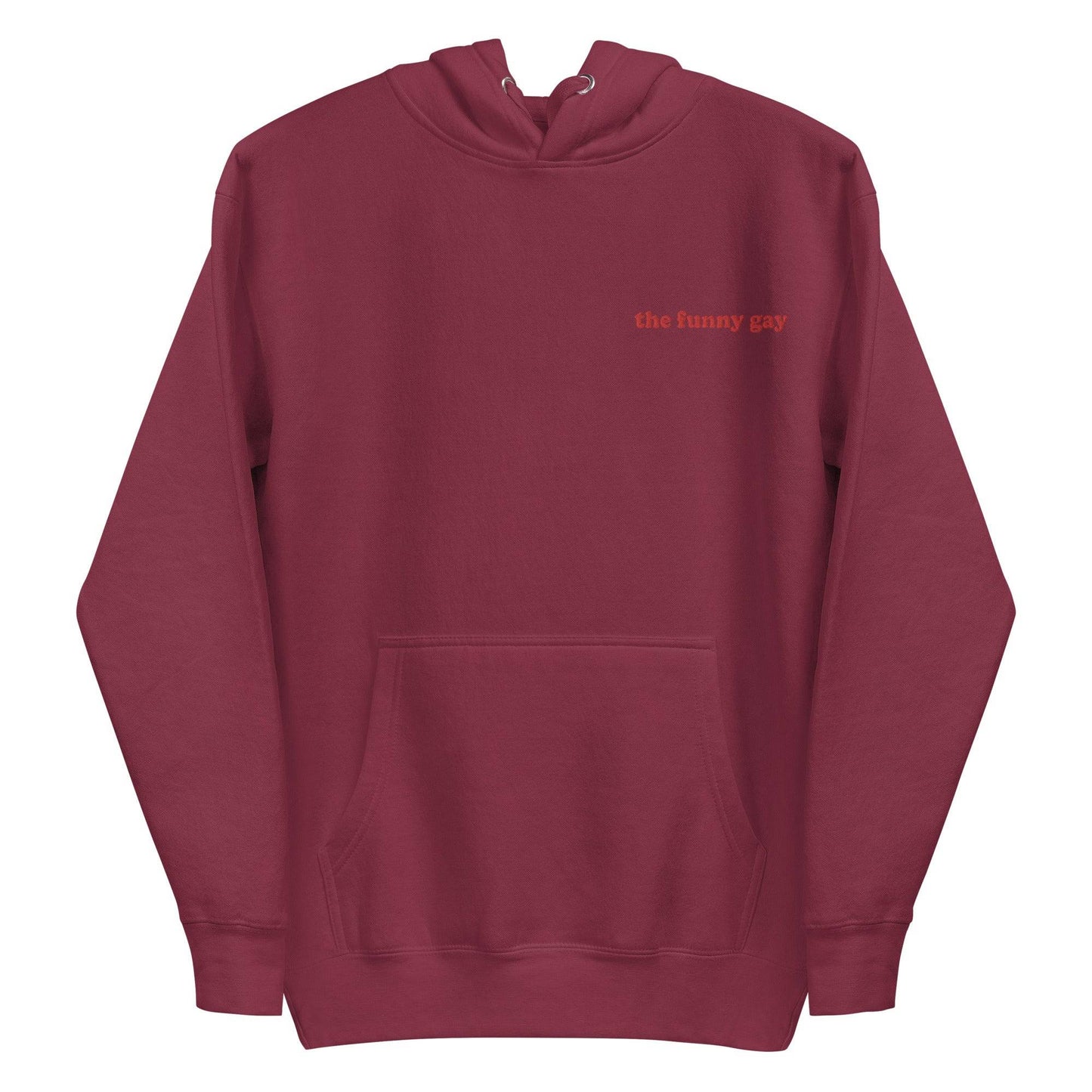 Introducing The Funny Gay Hoodie from Pridelity's pride collection – this black hoodie boasts a convenient front pocket and showcases the phrase "the funny gay" elegantly embroidered in small red letters on the upper left side. Celebrate your style with a nod to LGBTQ+ pride.