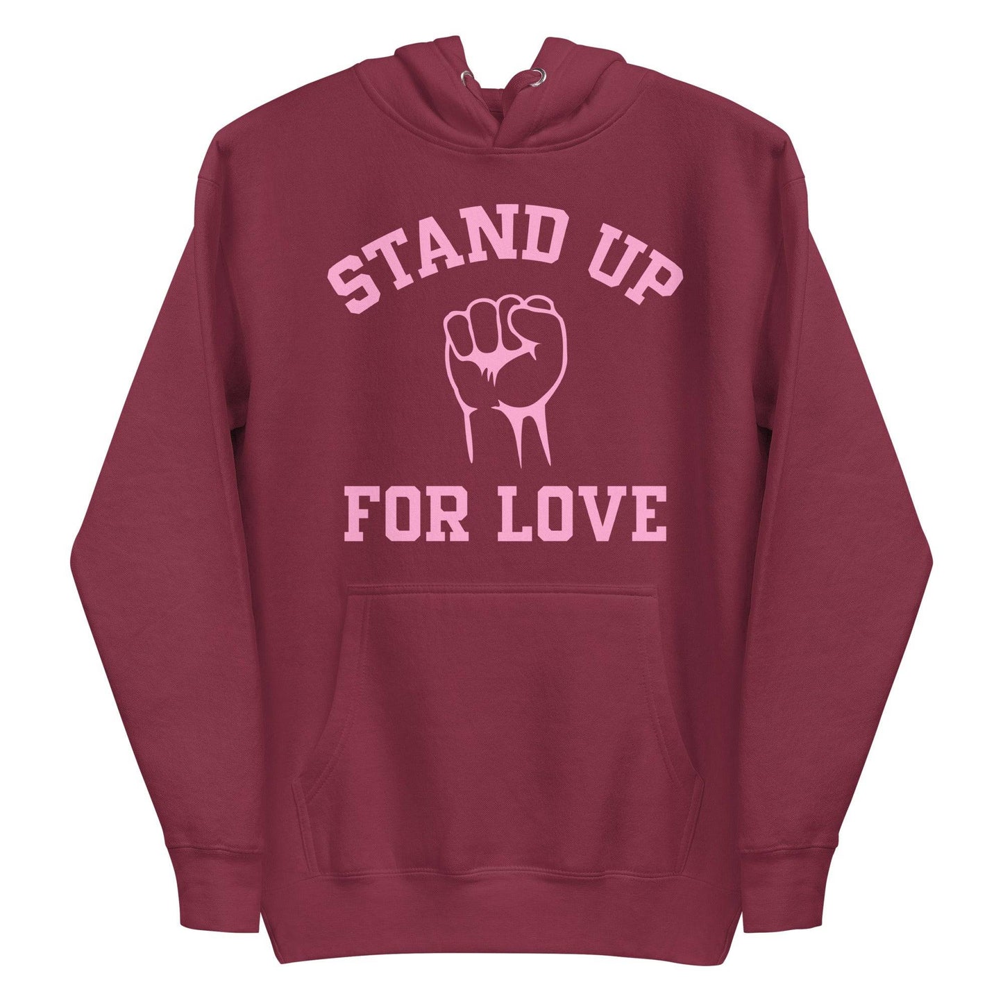 Check out the Stand Up Hoodie by Pridelity, a purple piece from our pride collection, adorned with "Stand Up For Love" in pink and a central raised fist graphic, celebrating LGBTQ+ solidarity.