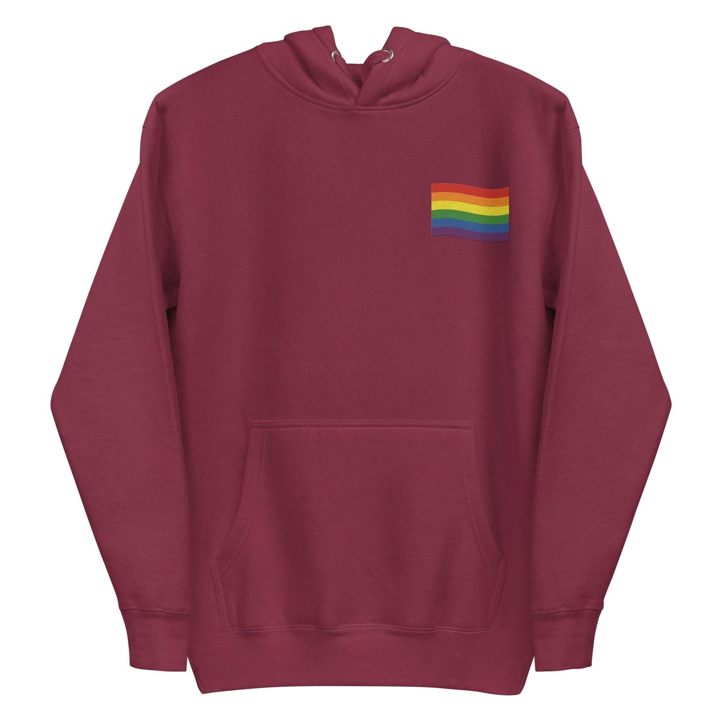 The Pride Flag Hoodie by Pridelity is a stylish white hoodie featuring a small rainbow flag design on the chest, ideal for pairing with pride shirts. It includes a front pocket and drawstring hood, showcasing vibrant horizontal stripes of red, orange, yellow, green, blue, and purple on the rainbow flag.