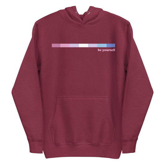 Introducing the Bigender Hoodie from Pridelity's Pride Collections, available in maroon. This hoodie showcases a front pocket and a beautiful horizontal gradient in pink and purple shades, with the phrase "be yourself" elegantly displayed in white on the right side of the chest.