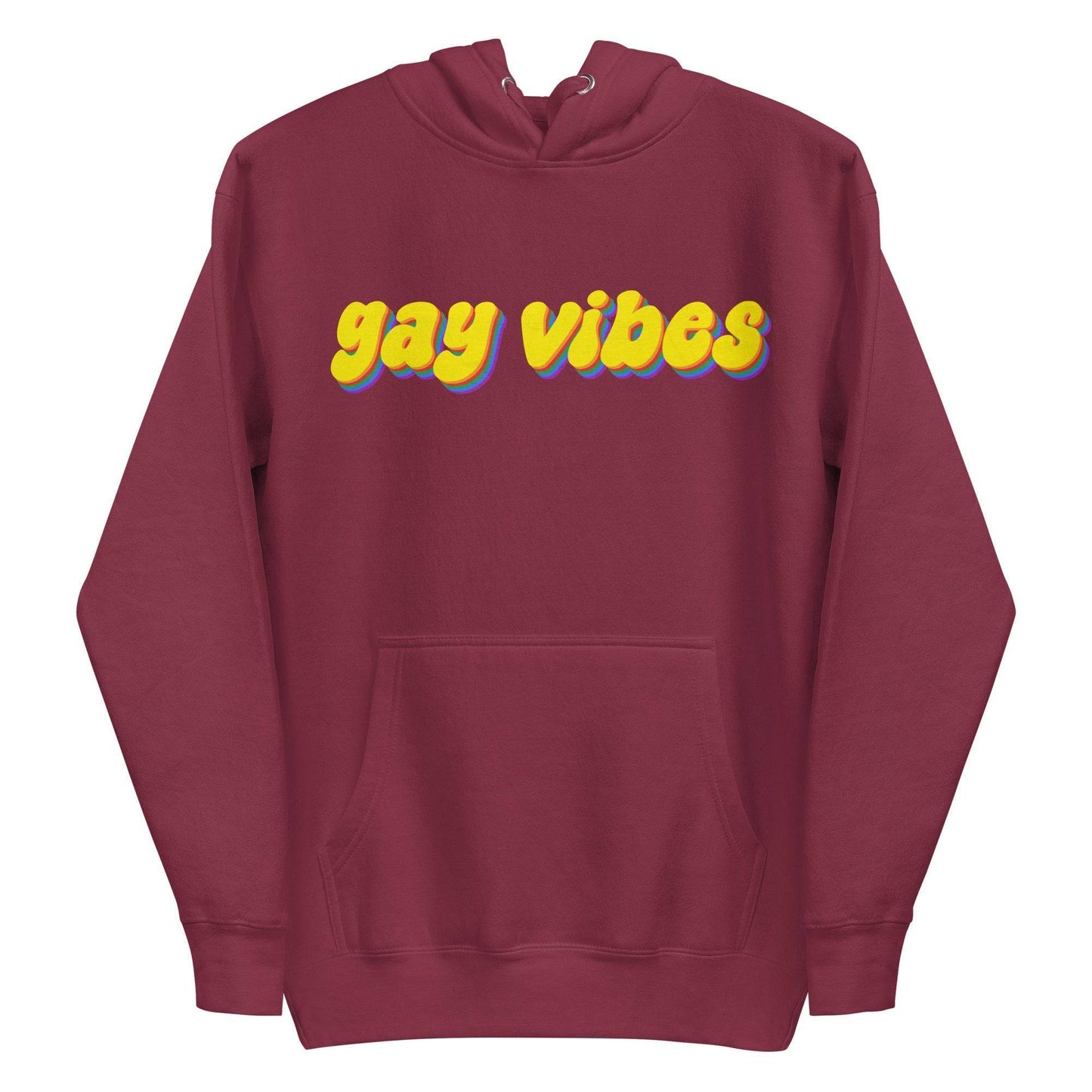 A Carbon Grey Gay Vibes Hoodie by Pridelity features the phrase "gay vibes" displayed in bold, colorful 3D-style yellow and purple text across the chest.