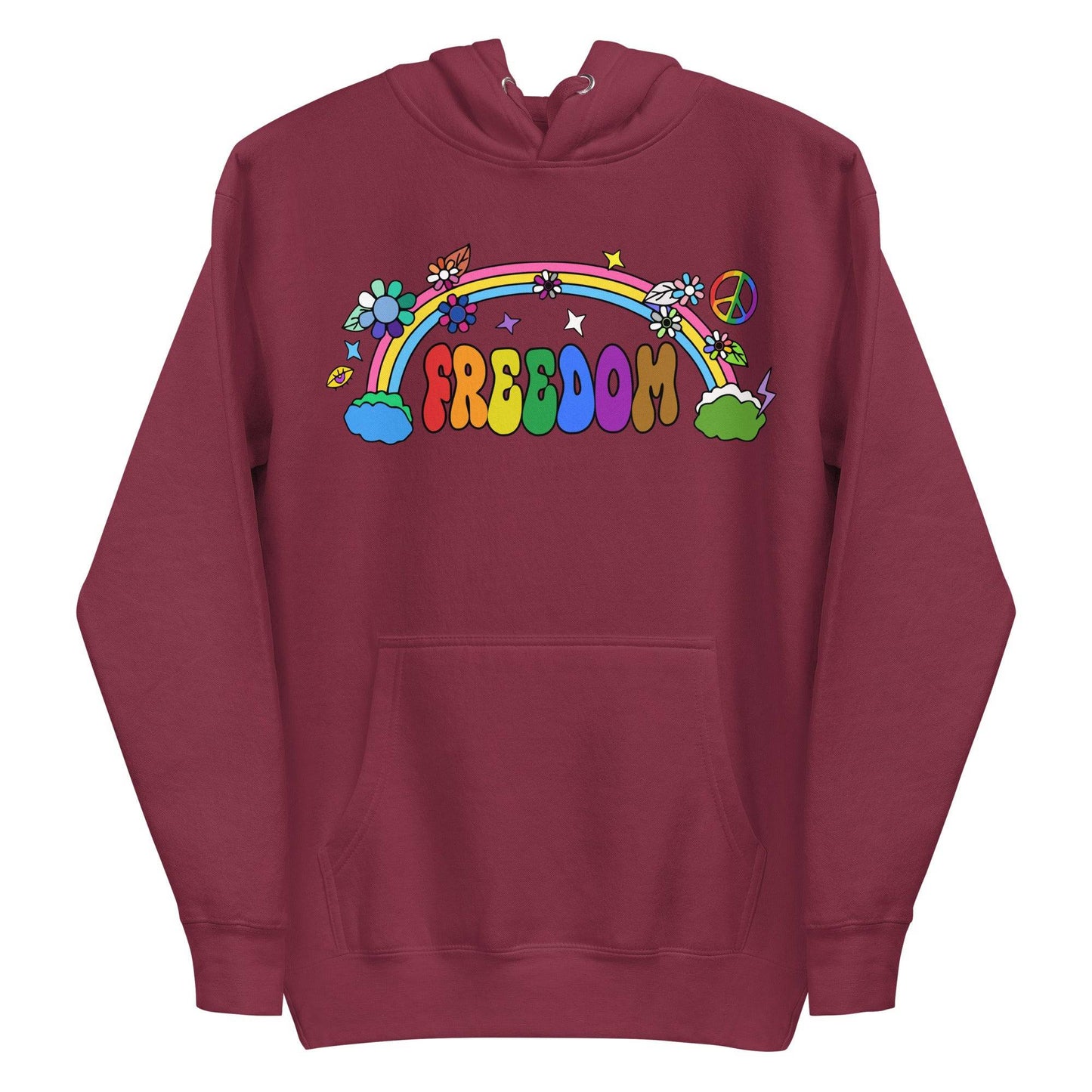 A folded dusty rose Freedom Hoodie from Pridelity features a vibrant design with "Freedom" in rainbow letters. It's adorned with flowers, stars, a rainbow, and a peace symbol, all in a playful retro style.