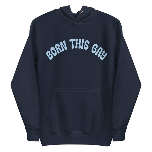 This navy blazer hoodie from Pridelity's Pride Collection prominently features "BORN THIS GAY" in light blue across the chest, complete with a convenient front pocket and a cozy drawstring hood, making it an essential piece of Pride Merch.
