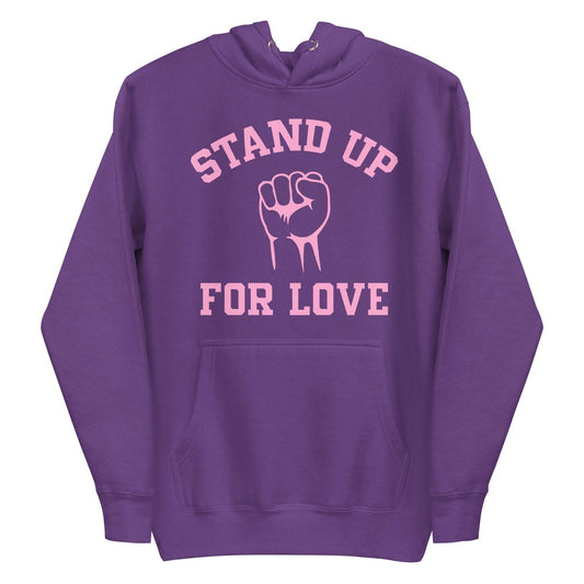 Check out the Stand Up Hoodie by Pridelity, a purple piece from our pride collection, adorned with "Stand Up For Love" in pink and a central raised fist graphic, celebrating LGBTQ+ solidarity.