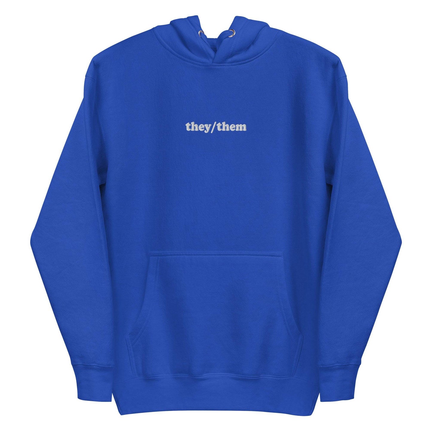 Introducing the They/Them Hoodie from Pridelity's pride collection. This LGBTQ+ friendly piece comes in a folded dusty rose color and features "they/them" text in white on the front. Complete with a drawstring, it offers a soft, casual appearance.