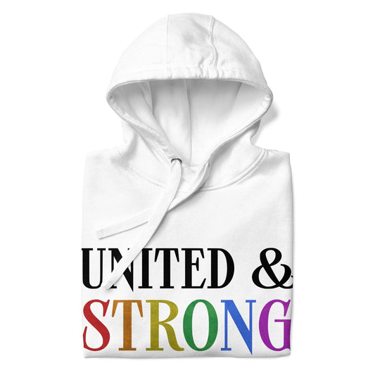 The Pridelity "United & Strong" hoodie from the pride collection is a folded white garment featuring bold text that reads "UNITED & STRONG." The word "STRONG" is adorned in a rainbow gradient, celebrating LGBTQ+ diversity and inclusivity. It comes with a drawstring hood, perfect for making a statement of unity and strength.