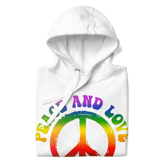 The Peace & Love Hoodie by Pridelity is a white hoodie adorned with a vibrant peace symbol and "Peace and Love" written in rainbow letters, capturing the essence of pride shirts.