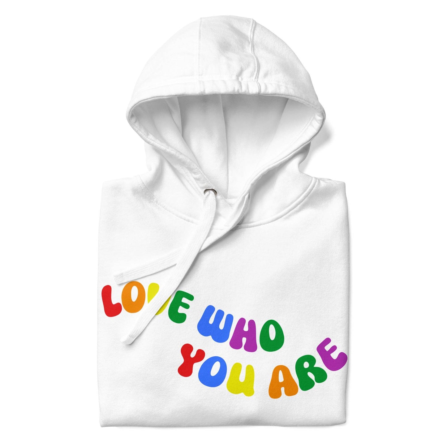 A folded Pridelity Love Who You Are Hoodie in white features vibrant, rainbow-colored text that boldly showcases the message "LOVE WHO YOU ARE" across the front. This design captures the spirit of pride apparel, honoring individuality and self-love through its colorful display.