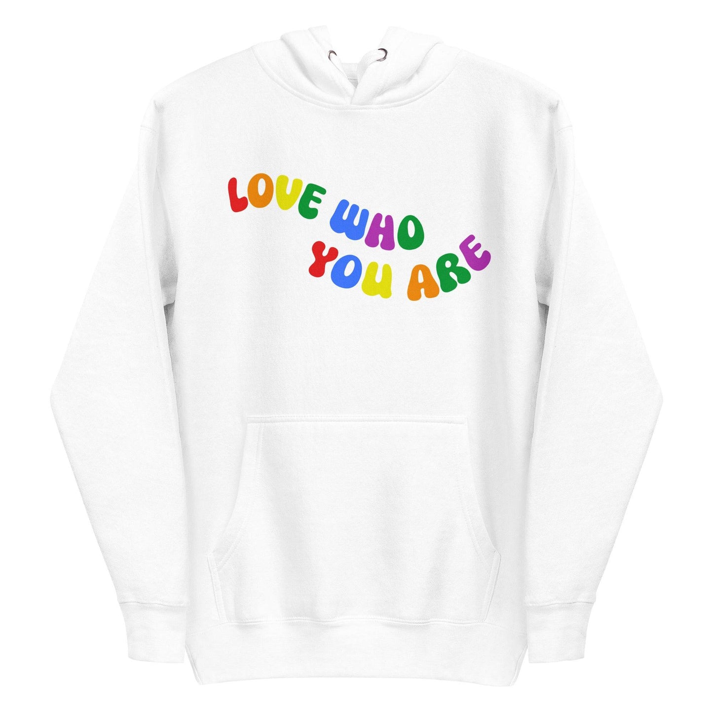 A folded Pridelity Love Who You Are Hoodie in white features vibrant, rainbow-colored text that boldly showcases the message "LOVE WHO YOU ARE" across the front. This design captures the spirit of pride apparel, honoring individuality and self-love through its colorful display.