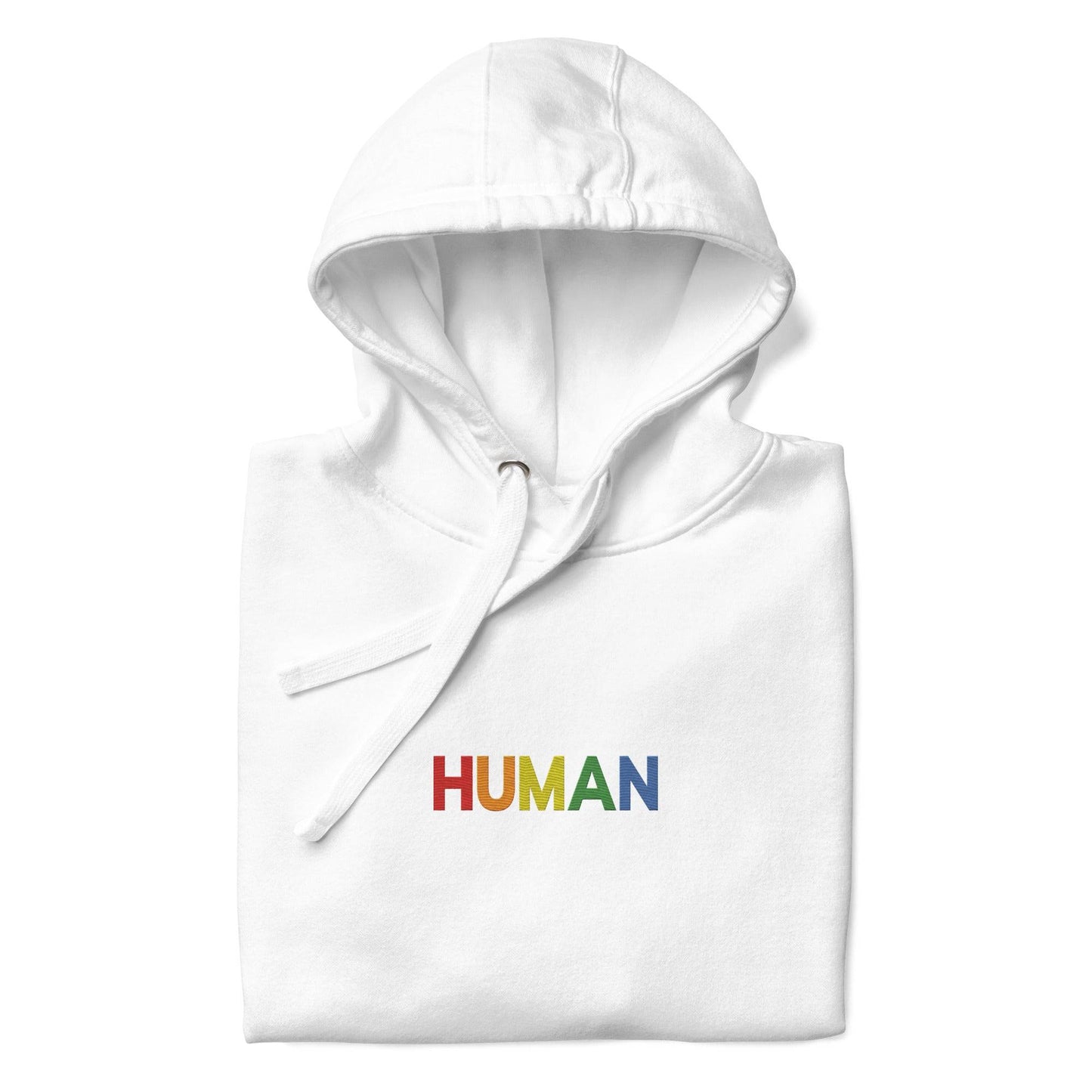 A folded Pridelity Human Hoodie, showcasing a crisp white design with "HUMAN" embroidered in vibrant rainbow colors on the front. The hood is laid flat, with its drawstrings visible, celebrating individuality and self-expression.