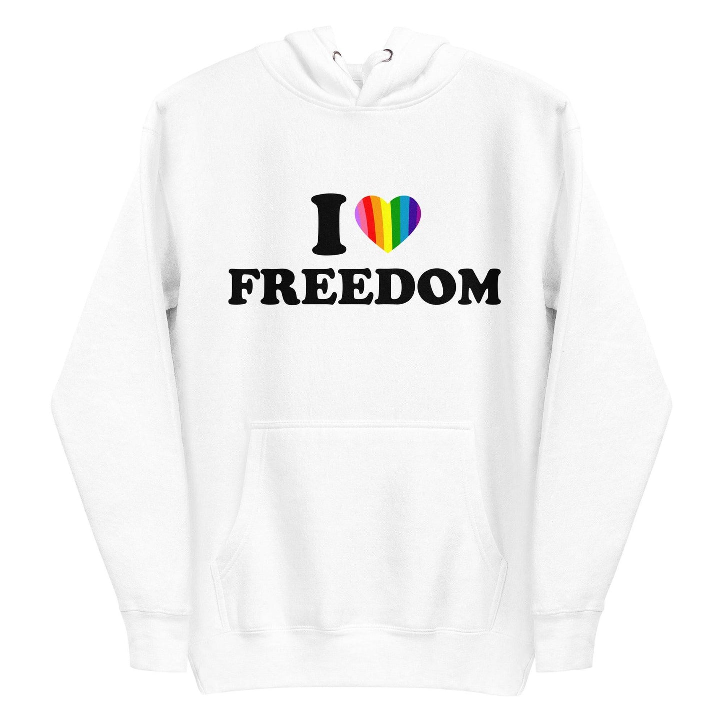 A neatly folded white "I Love Freedom Hoodie" by Pridelity showcases the phrase "I ♥ FREEDOM" accompanied by a rainbow heart, symbolizing diversity and inclusivity. The hoodie is arranged with drawstrings and the hood prominently displayed on top.