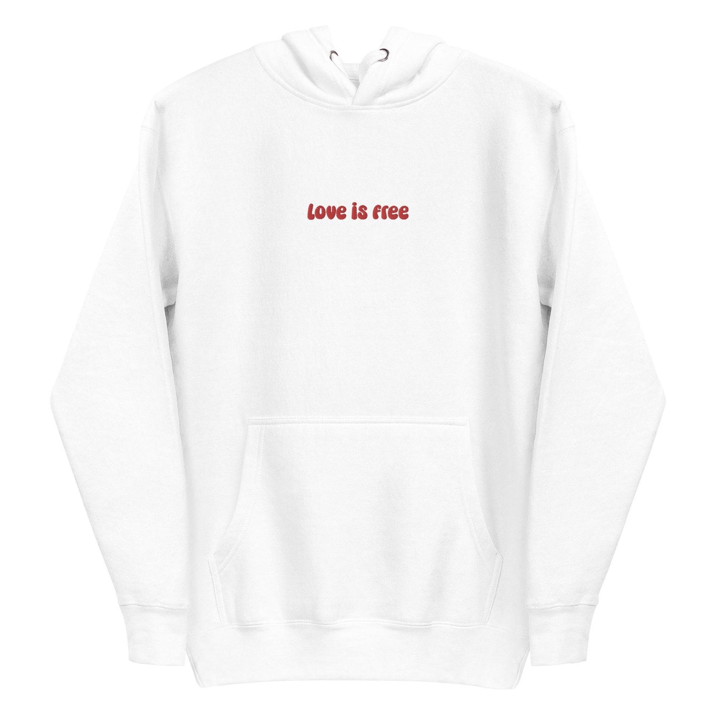 The Love Is Free Hoodie by Pridelity captures the essence of pride shirts with its folded design, featuring a hood and drawstrings, and proudly showcases the message "love is free" in red on its white front.